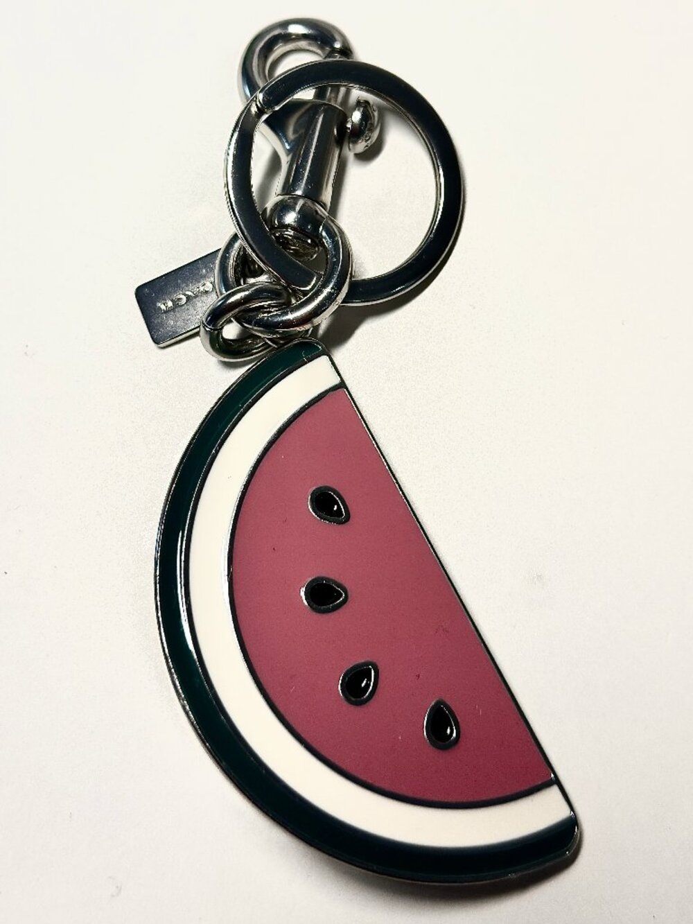 Excellent condition Coach enamel watermelon bag charm.  All 5-star reviews.